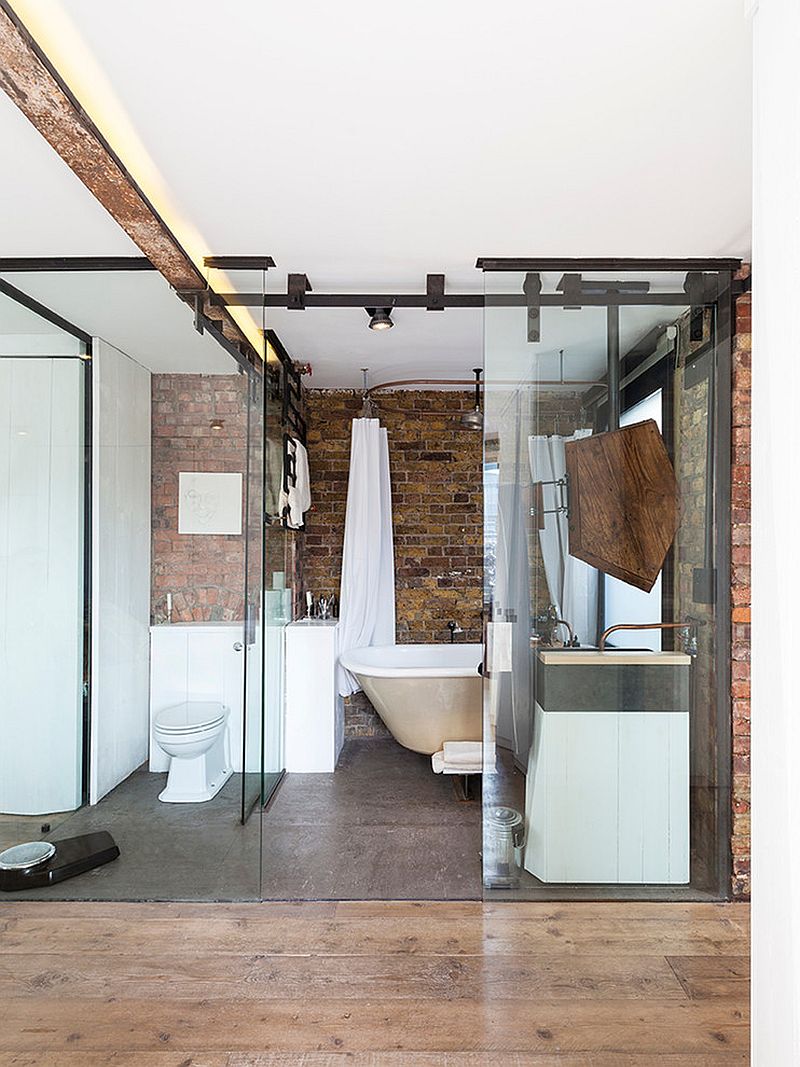 Glass and brick fashion a lovely fusion of contemporary and industrial styles in the bathroom [From: Nathalie Priem Photography]