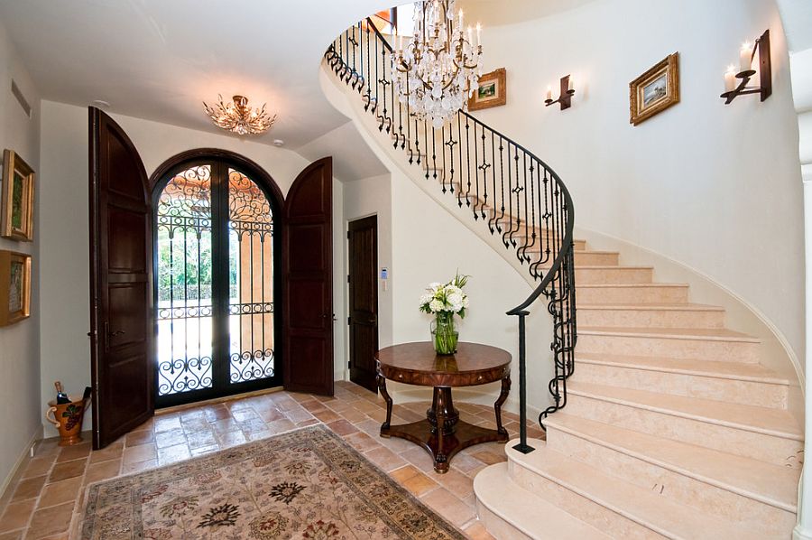 Gorgeous double door entry and spiral staircase [Design: Robelen Hanna Homes]