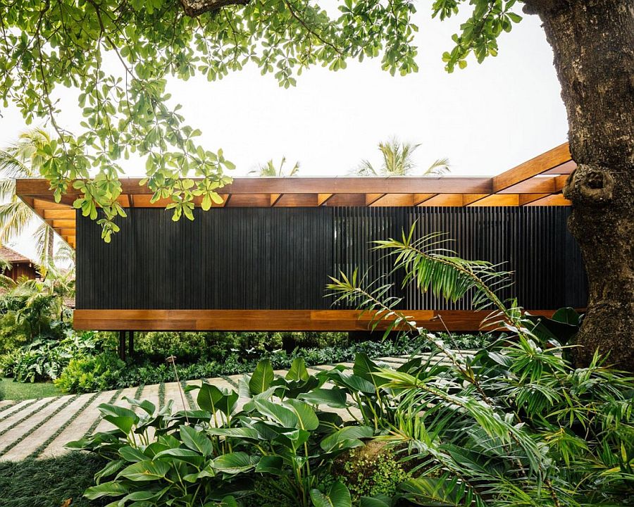 Greenery fills the entrance of House RT in Rio