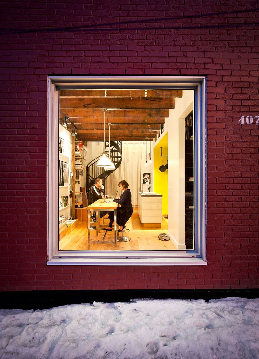 Home workspace and living area flow into one another at this Montreal residence