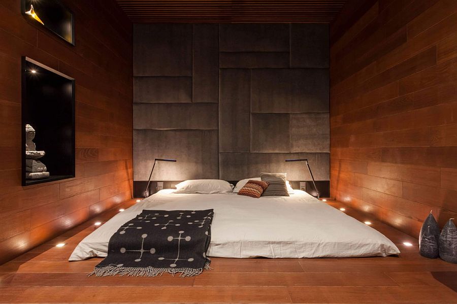 In-ground lighting around the beds adds another dimension to the minimal bedroom