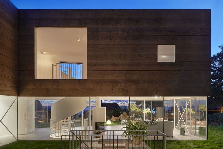 Interior of the home shines through after sunset thanks to lovely lighting