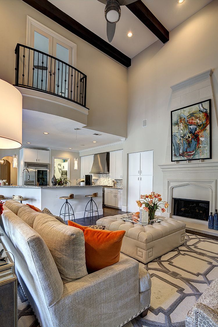 Juliet Balcony with iron railings on the top level overlooks the Mediterranean living room