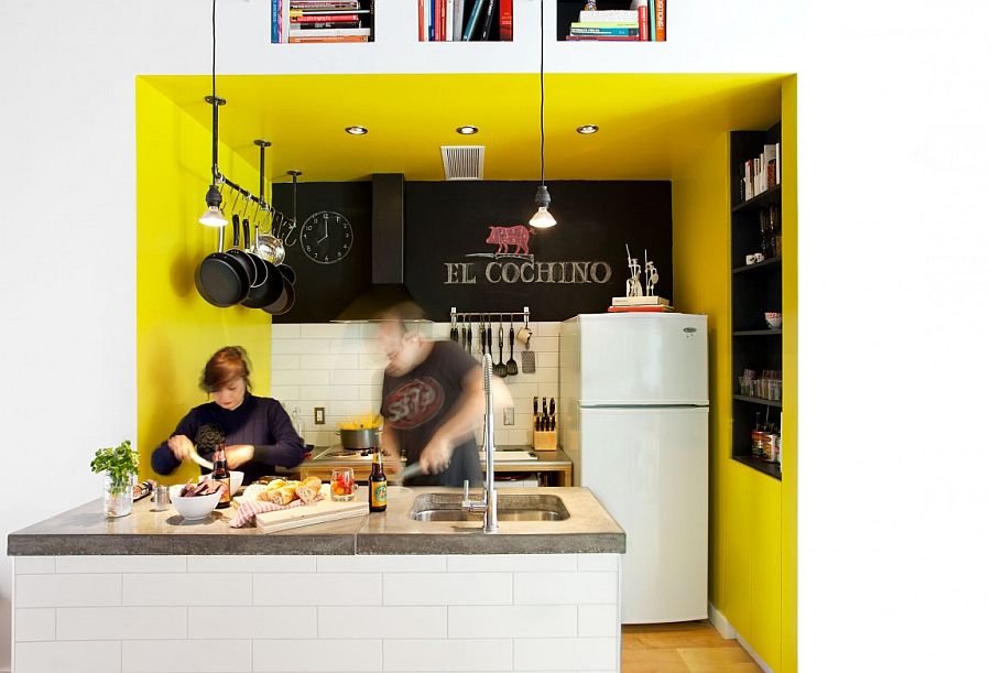 Kitchen adds a dash of yellow and black to the home along with chalkboard walls