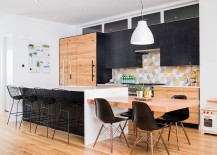 Kitchen-with-dark-cabinets-geometric-tiles-and-a-smart-island-217x155
