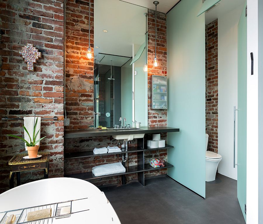 Lighting in the bathroom accentuates the beauty of exposed brick walls [Design: Crescent Builds]