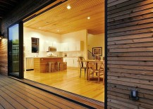 Lower-level-living-area-is-connecetd-with-the-large-wooden-deck-outside-217x155