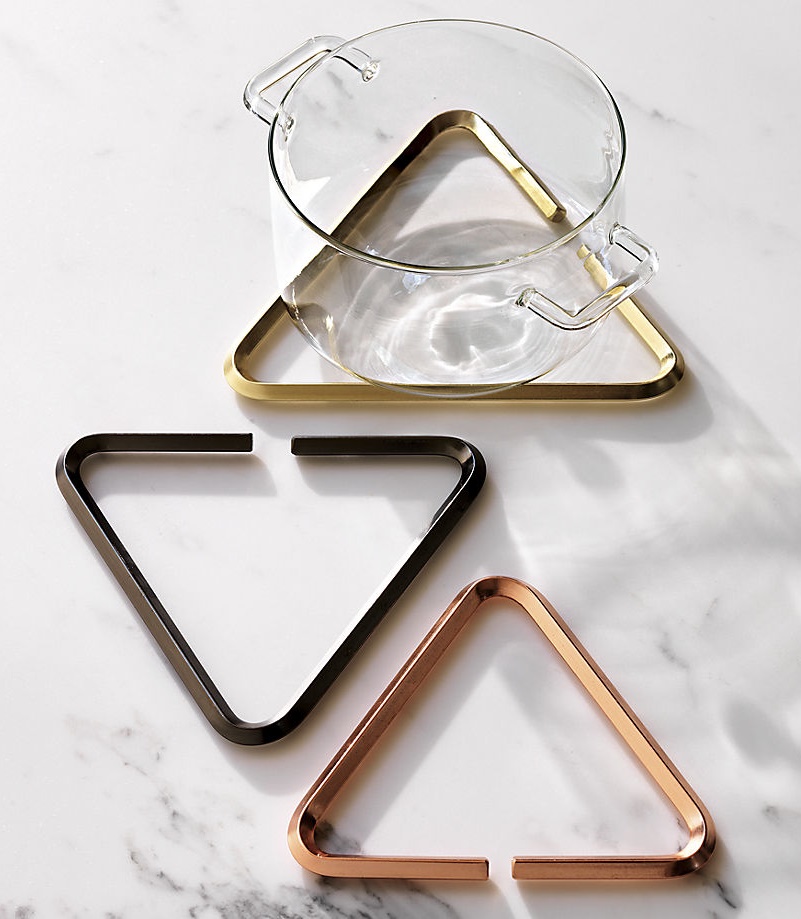 Metal trivets in black, rose gold and brass tones from CB2