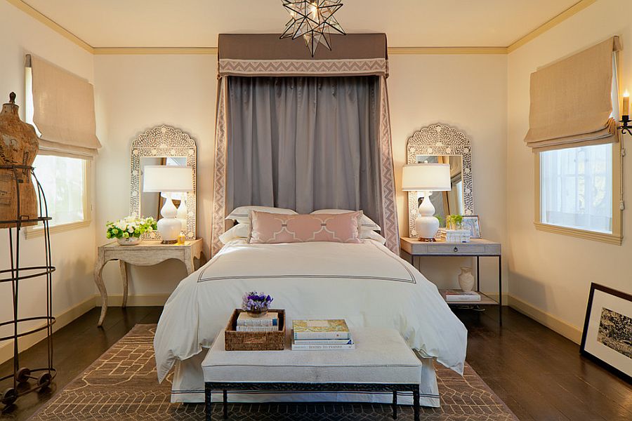 Mirrors accentuate the beauty of the table lamps in this Mediterranean bedroom [Design: Laura Martin Bovard]