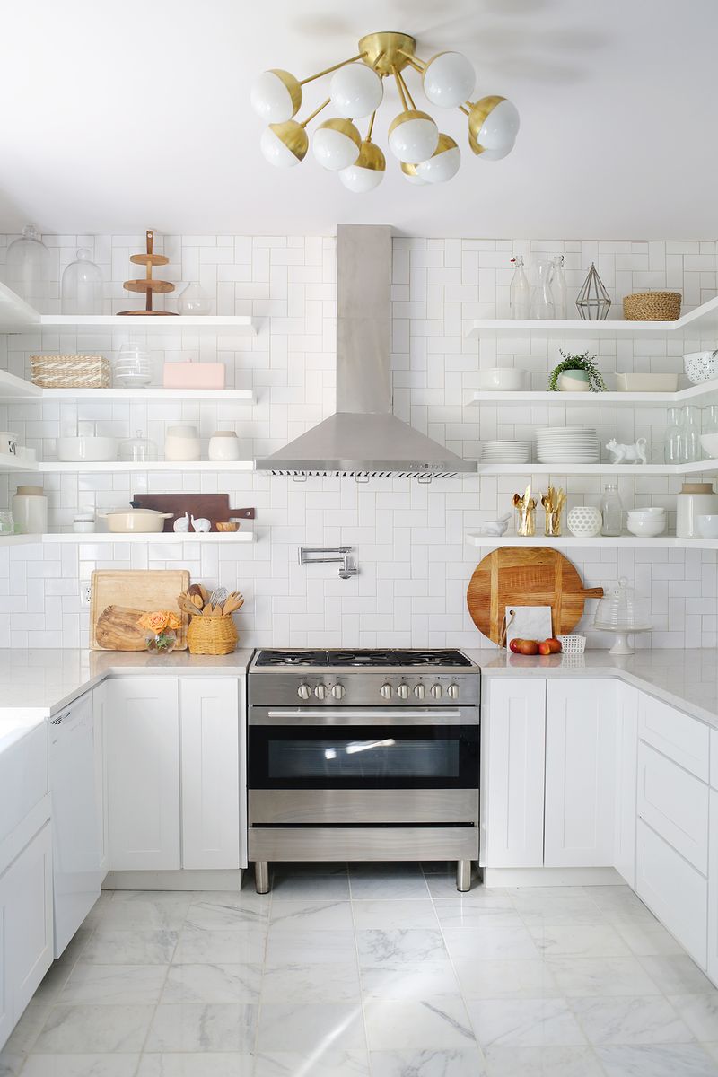 Mixed materials kitchen with a patterned backsplash