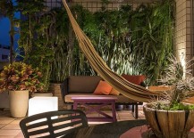 Natural-greenery-and-hammock-create-an-urban-retreat-on-the-top-level-of-the-penthouse-217x155