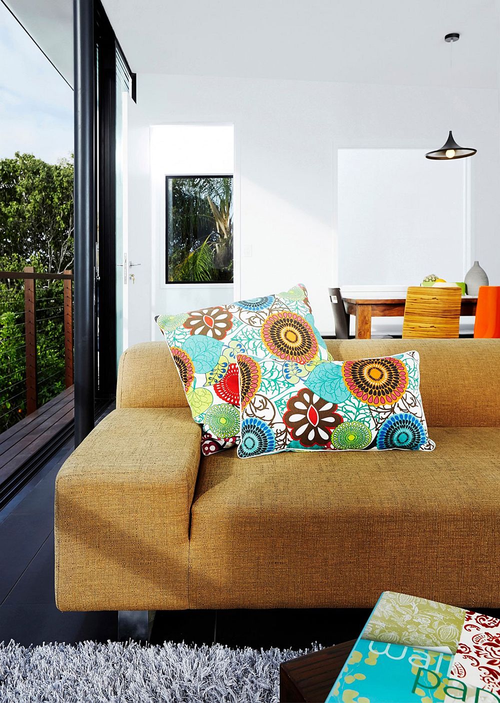 Neutral backdrop of the gardenhouse is enlivened by colorful decor and accessories