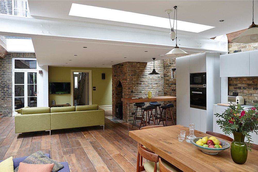 Open plan living area with kitchen and dining of the revamped London home