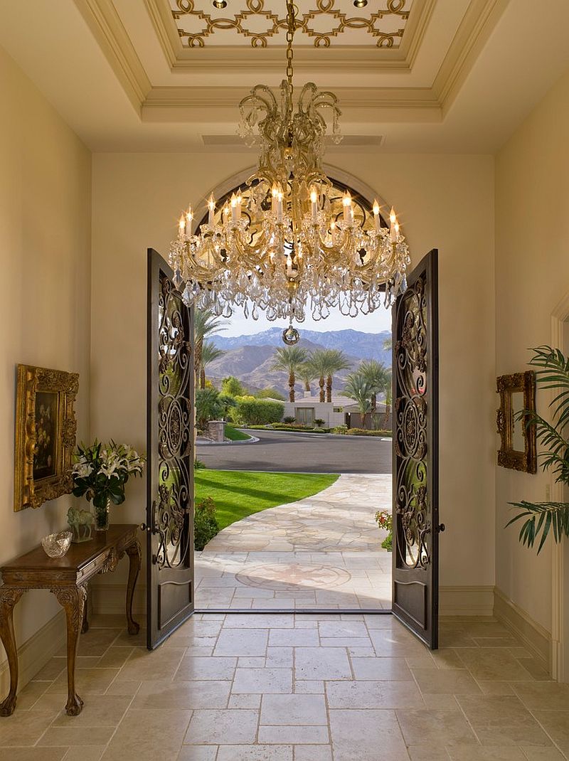 Ornate ceiling and sparkling chandelier fit in with the Mediterranean theme