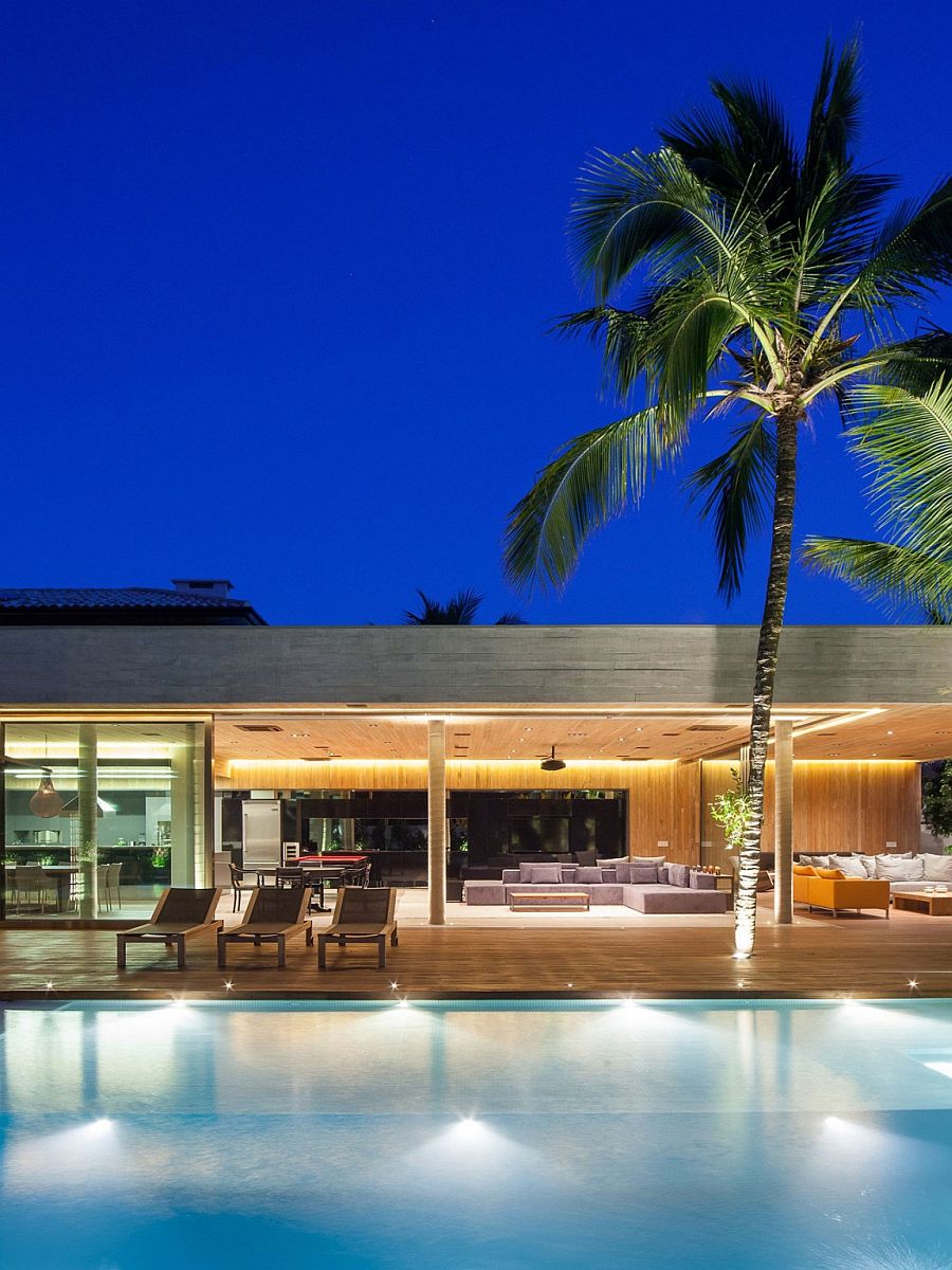 Outdoor in-ground lights around the pool create a dazzling ambiance