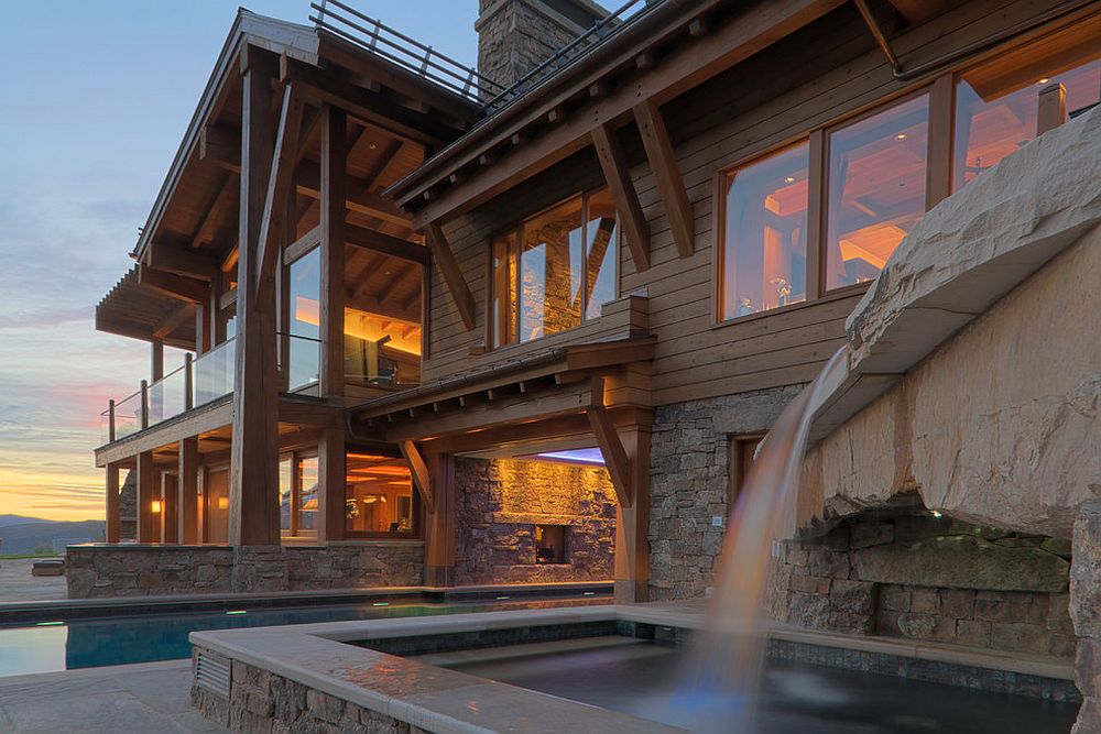 Outdoor pool and waterfall fetaure of the luxurious mountain retreat