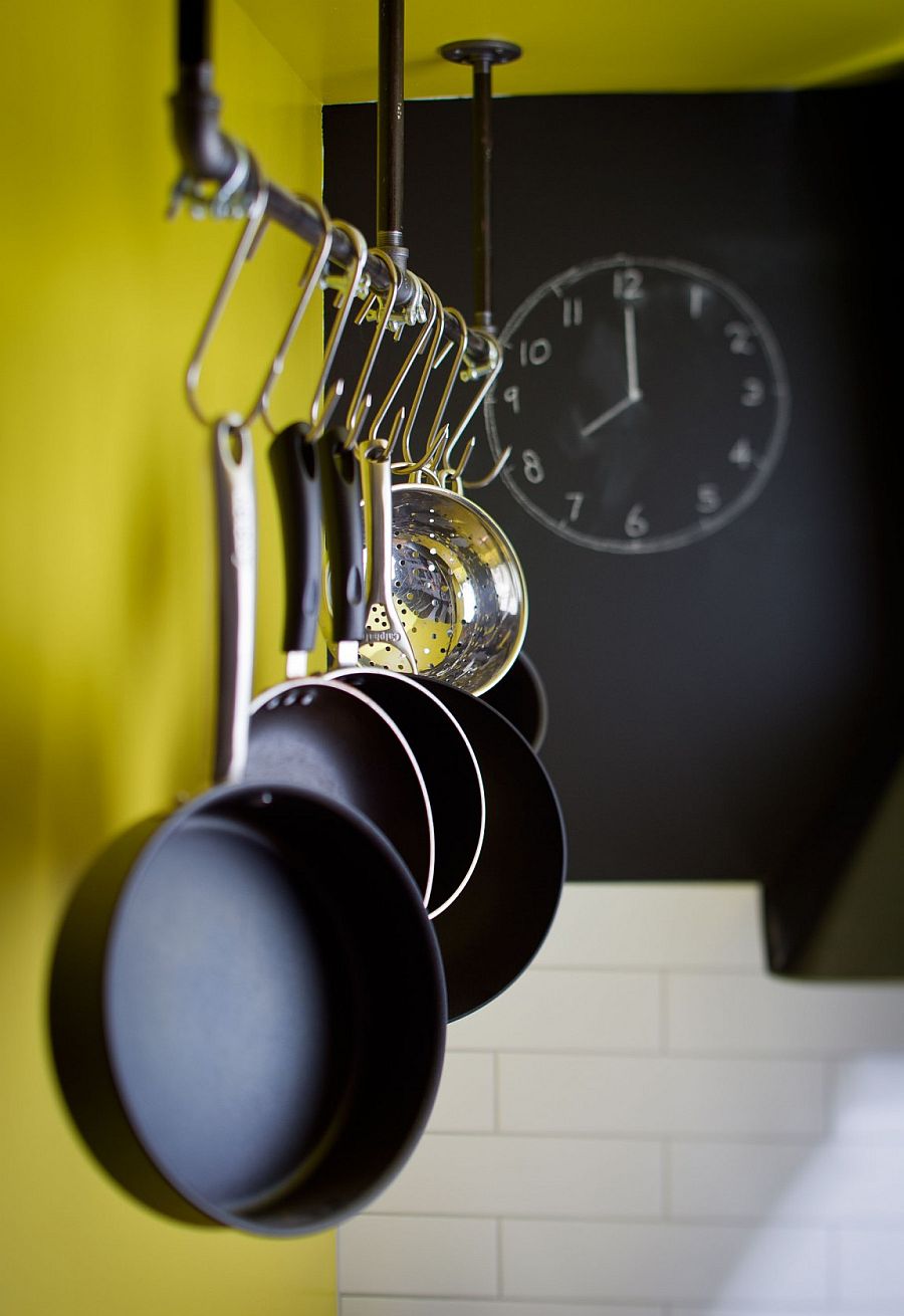 Pot rack in the kitchen fits in perfectly with the home's industrial flair