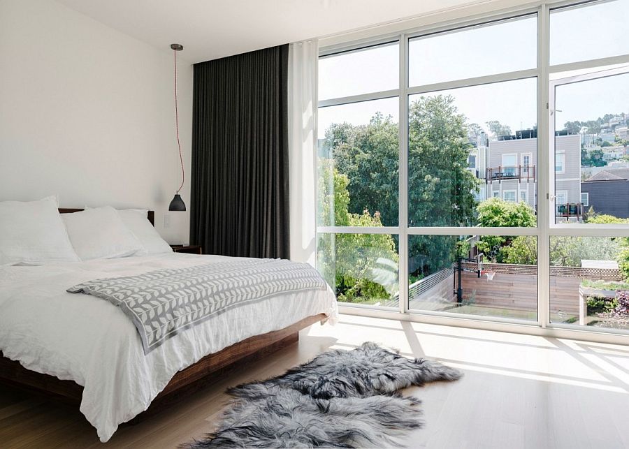 Private master bedroom with a view of the backyard