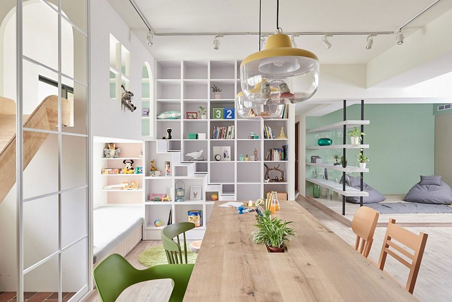 Shelves and architectural features demarcate spaces in the open plan living area