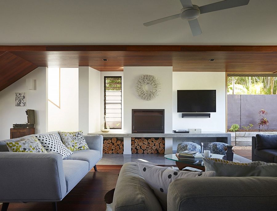 Stacked wood creates textural contrast in the living room