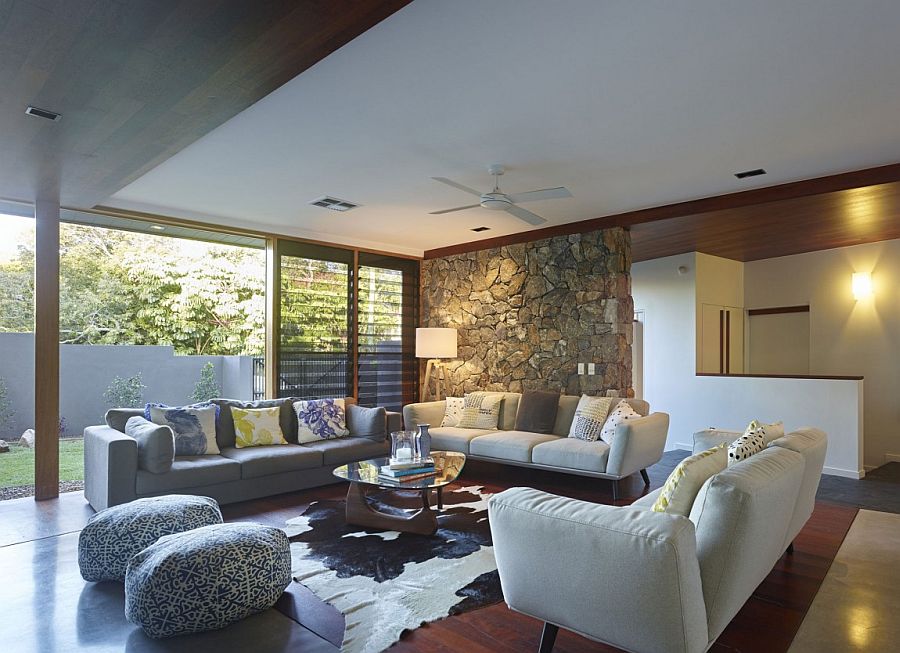 Stone accent wall in the living room with simple beach style