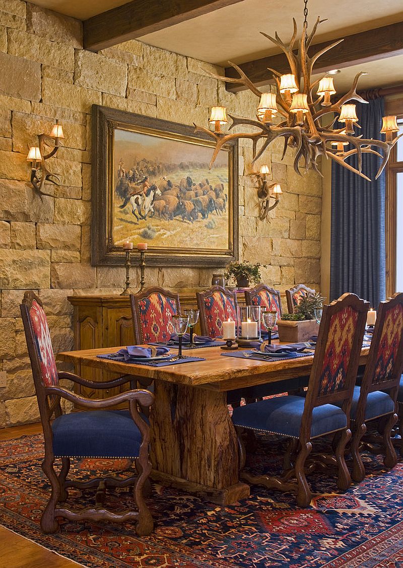 Stone wall and antler lighting for the rustic dining room