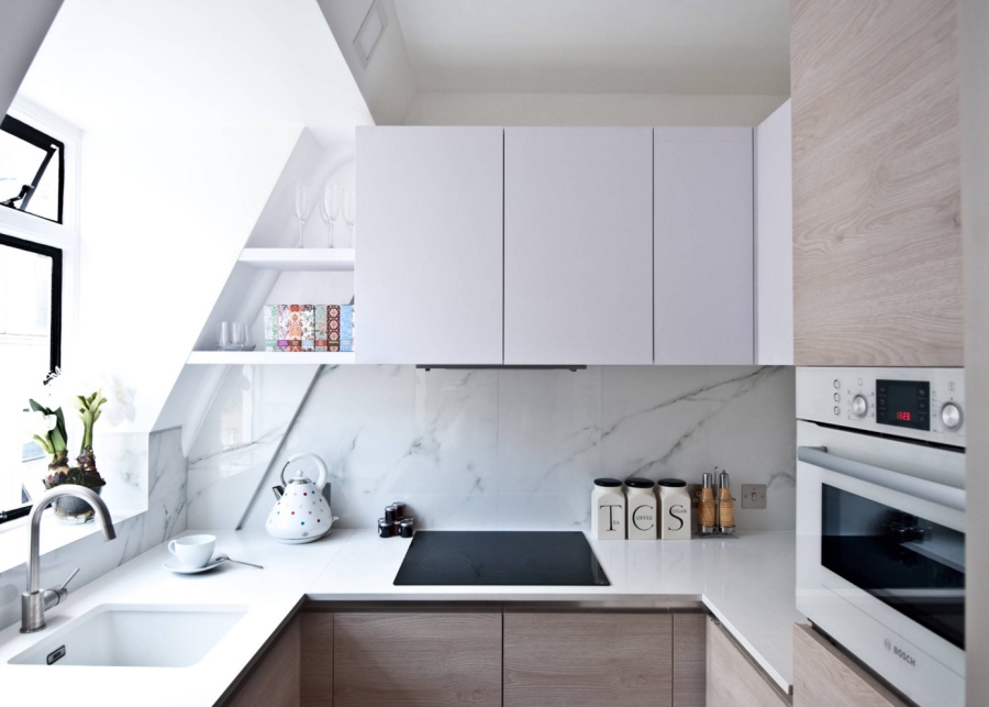 Studio apartment kitchen with marble and wood