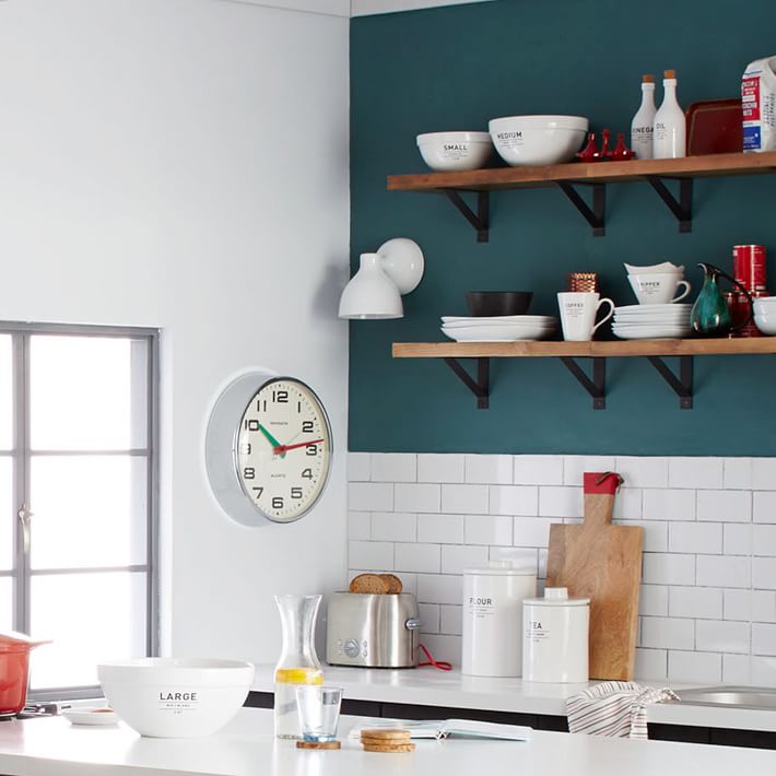 Teal kitchen with a subway tile backsplash