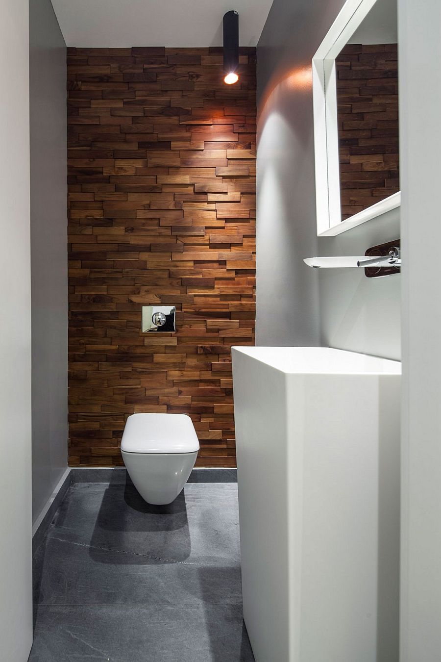 Textured wooden accent feature inside the small bathroom