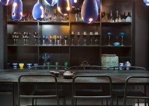 Vintage-colored-glasses-and-bold-lighting-for-the-dark-dining-area-217x155