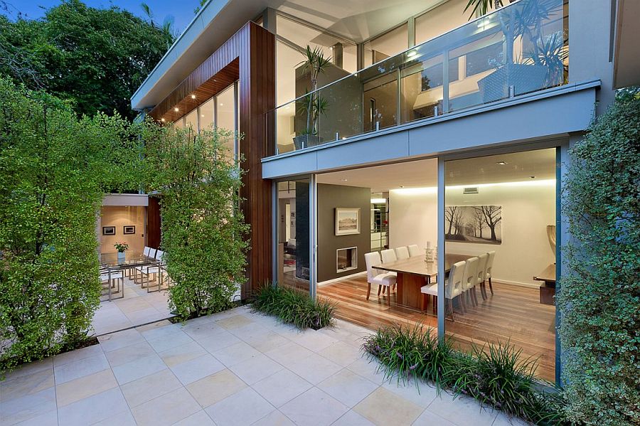 A green archway adds to the beauty of the rear courtyard