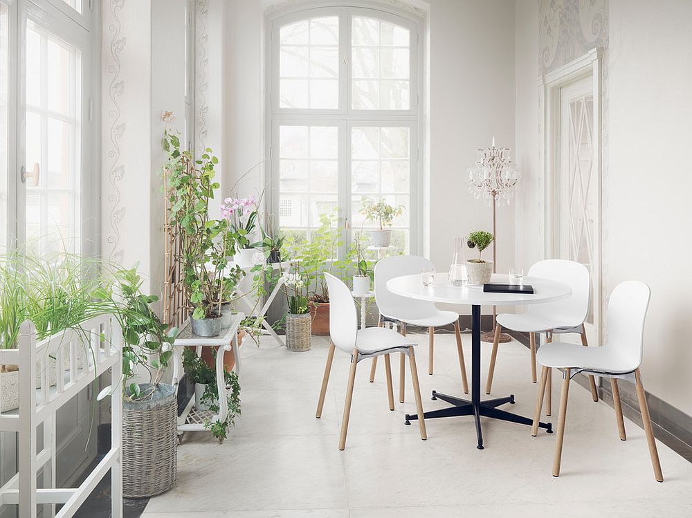 A healthy dose of greenery for the all-white Scandinavian sunroom