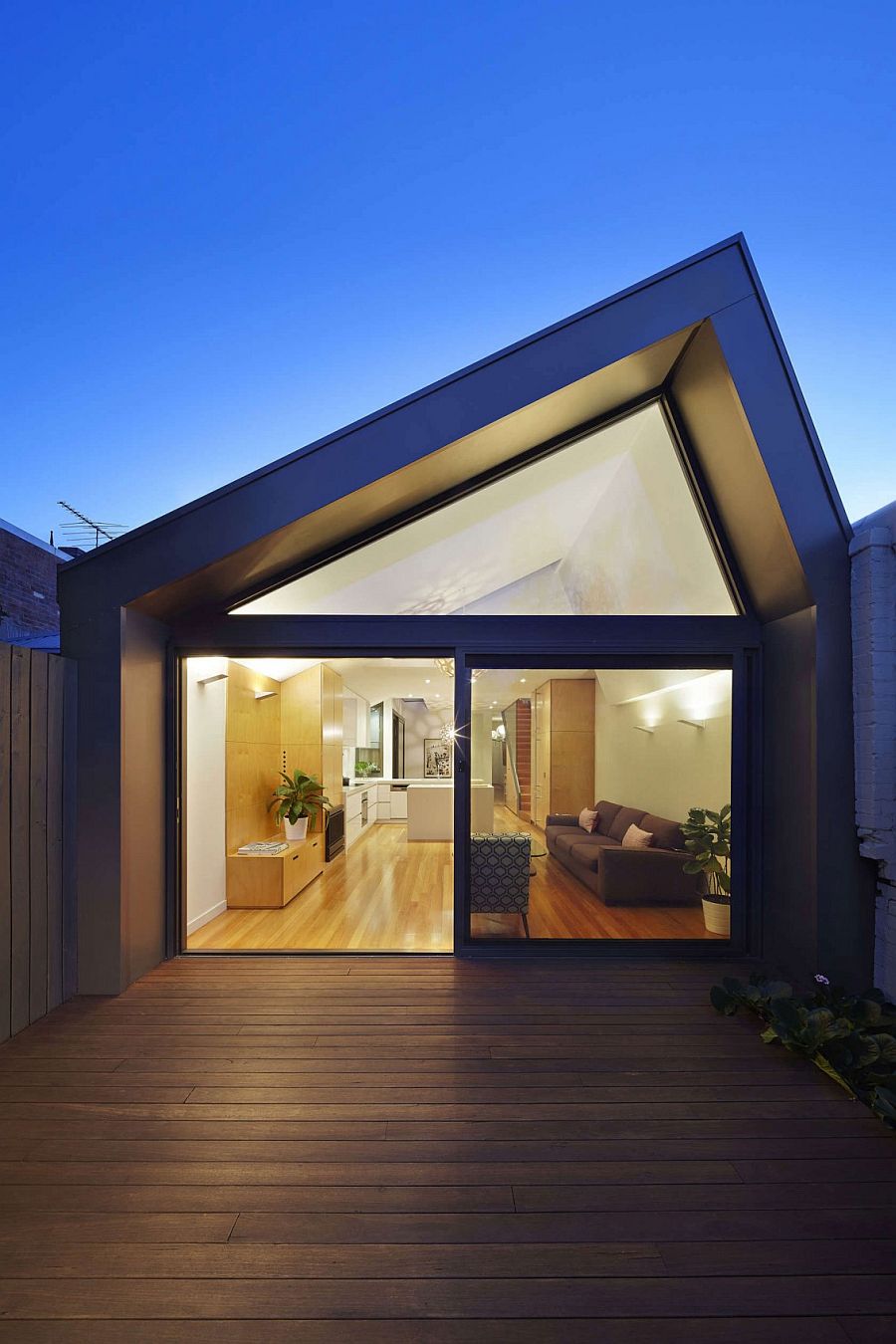 Ambient and pendant lighting brings the lower level living area alive