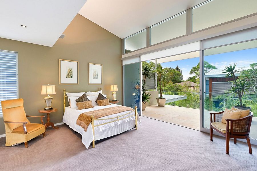 Bedroom on the top level with a view of the courtyard