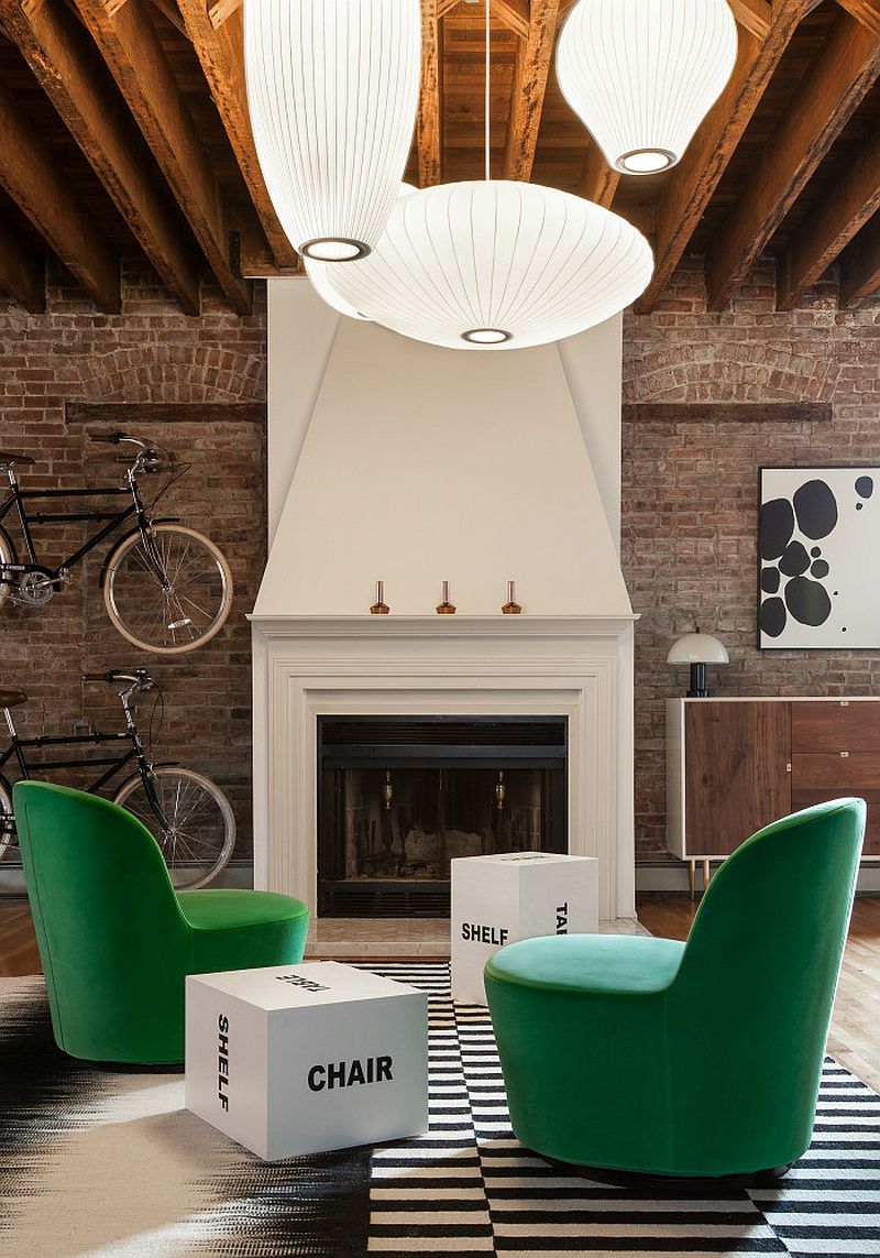 Black and white rug and green velevt armchairs from IKEA in the living room