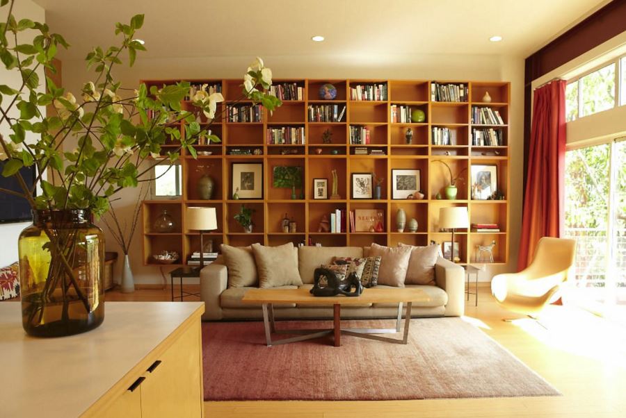 Books, art and objects on a large bookshelf