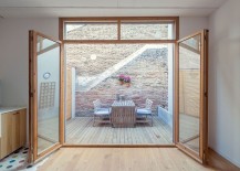 Brick-wall-and-outddor-deck-of-the-renoavted-row-house-in-Barcelona-217x155