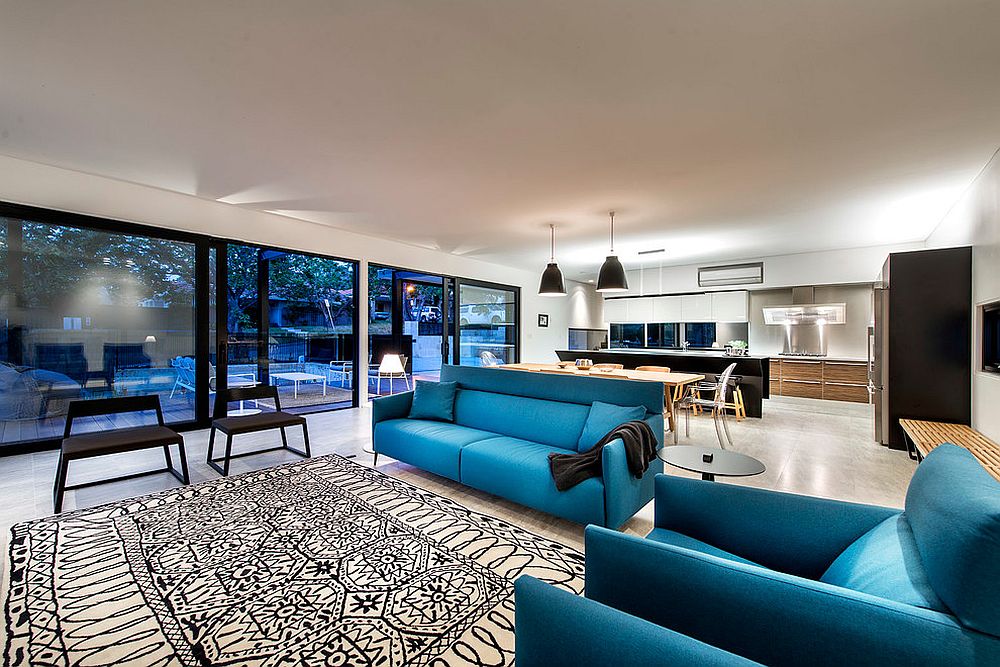 Bright blue sofas add color to the living area