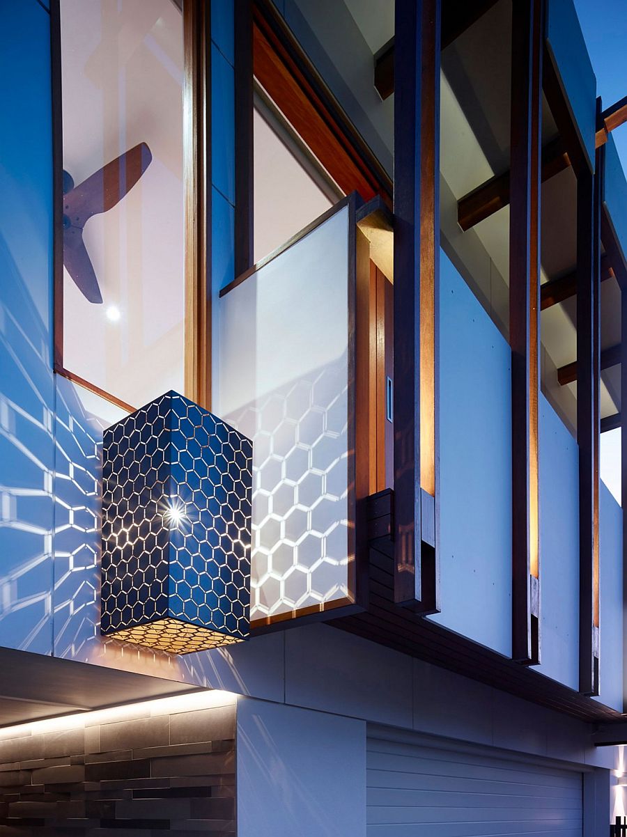 Brilliant lighting fixture adds hexagonal pattern to the walls around it!