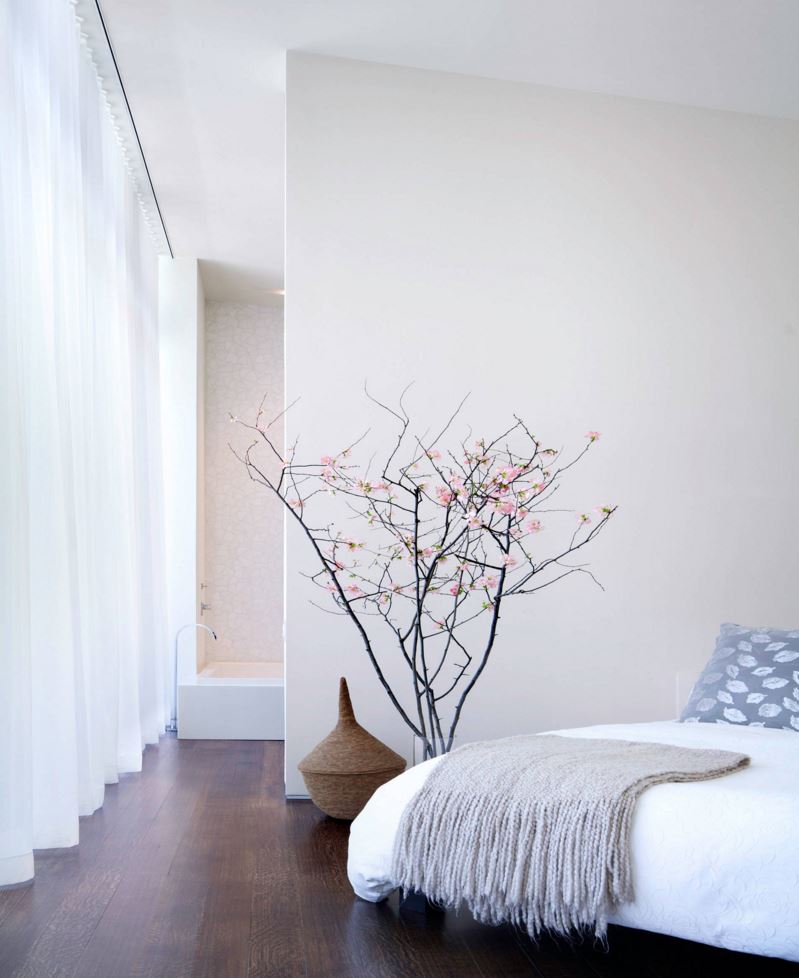 Cherry blossom branches in a modern bedroom