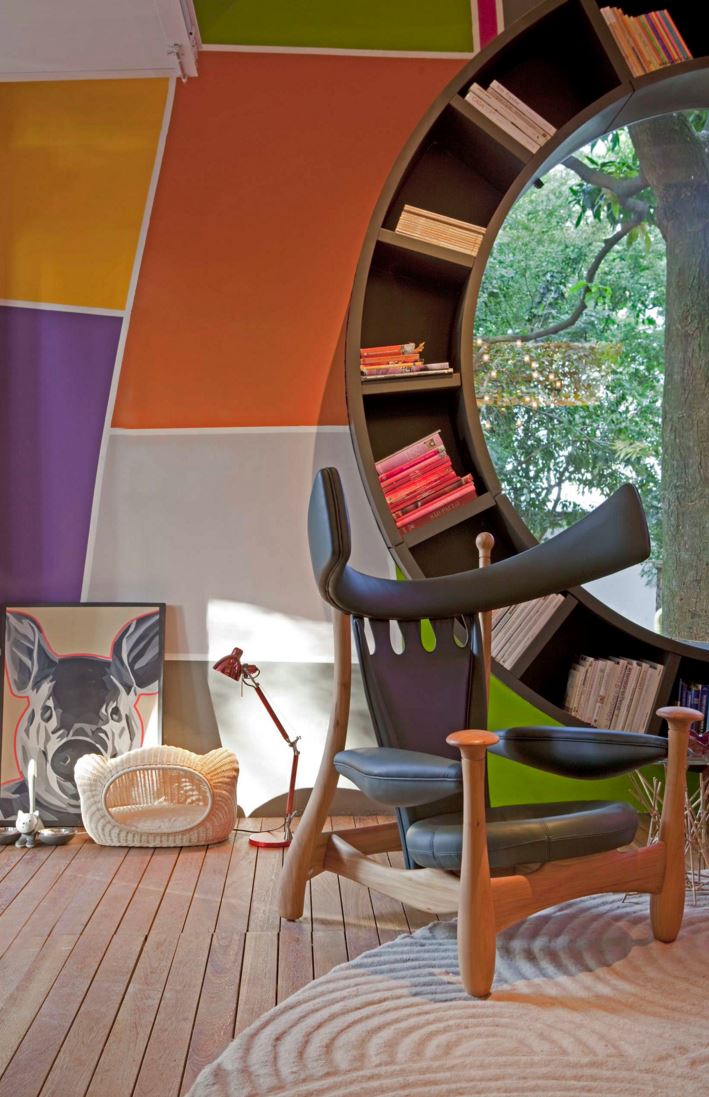 Circular bookshelf with color-coded stacks