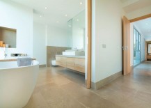 Contemporary-bathroom-with-wooden-vanity-and-minimal-vibe-217x155