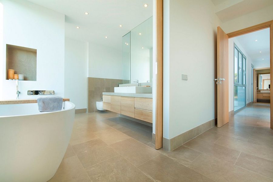 Contemporary bathroom with wooden vanity and minimal vibe