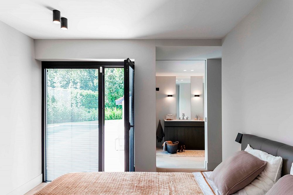 Contemporary bedroom with a view of the garden and the pool