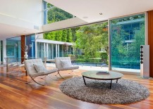 Contemporary-interior-with-large-glass-wall-and-wooden-flooring-217x155