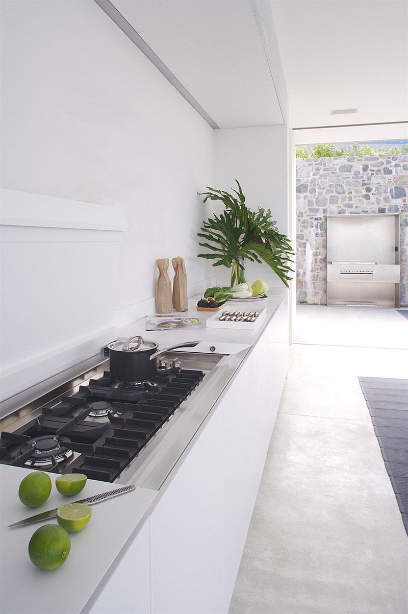 Contemporary kitchen in white with a sleek workstation