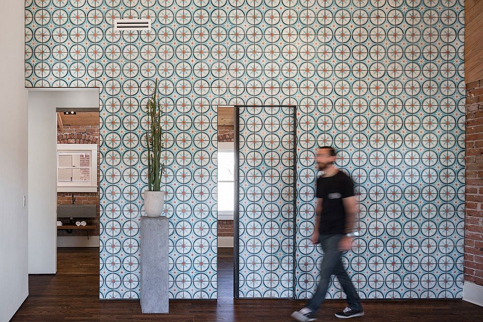 Contemporary renovation adds color and pattern to the brick-wallled interior