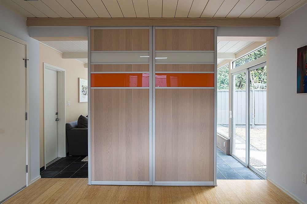 Custom panels hide the TV in the family room