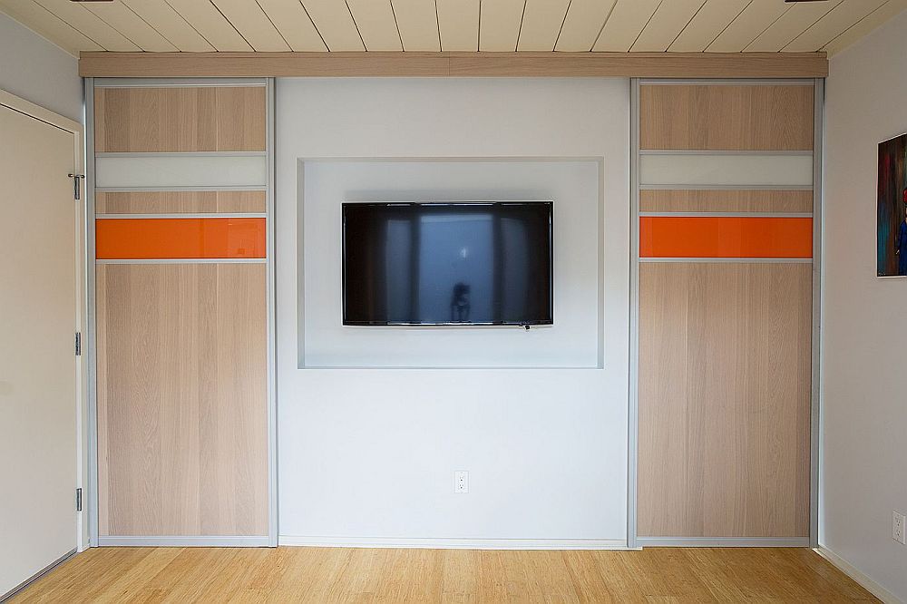 Custom panels separate the TV room from the sunroom