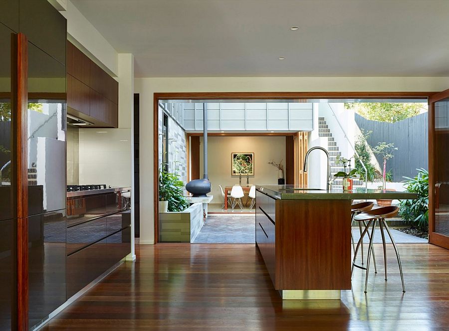 Design of dining room, kitchen and living spaces creates a cool indoor-outdoor interplay
